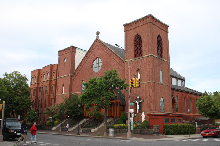 The Holy Name of Jesus, a red brick church, where Housing Not Highrises has community discussions about how to preserve community.